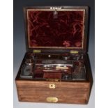 A Victorian rosewood rounded rectangular dressing box, hinged cover with flush brass handle,