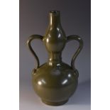 A Chinese tea dust glaze monochrome double gourd shaped two handled vase, 27cm,