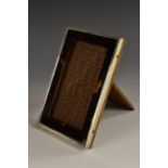 A George V silver and tortoiseshell rectangular easel photograph frame, quite plain, 14.