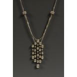 An articulated diamond five frond pendent necklace,