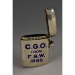 A Victorian silver and enamel rounded rectangular vesta case, inscribed C.G.O from F.B.
