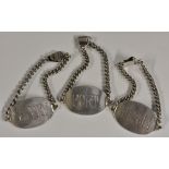 A set of three sterling silver oval wine labels, Port, Sherry and Whisky, engraved lettering,