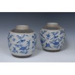 A pair of Chinese crackle glaze stoneware ginger jars, painted in underglaze blue with peonies,