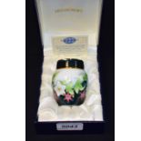 A Moorcroft enamel miniature jar and cover, floral decoration,