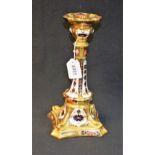 A Royal Crown Derby 1128 pattern Castleton candlestick, dolphins to angles, incurved square base,