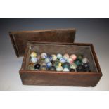 A collection of 19th century glass marbles, various types and sizes, oak box with sliding cover,