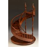 An apprentice's mahogany architectural spiral staircase, turned finial support-ends,