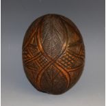 A 19th century carved coconut 'bug bear' flask,