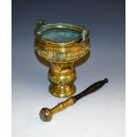 A Continental brass aspersorium or holy water bucket, chased with bands of acanthus lunettes,