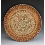 A 19th century Islamic copper shaped circular tray,