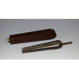 A 19th century pocket tuning fork, rosewood haft screw-fitting for travel,