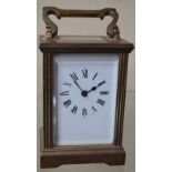 A French lacquered brass carriage timepiece,