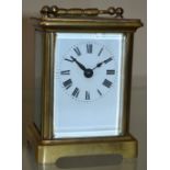 An early 20th century French lacquered brass carriage timepiece, 5.