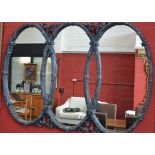 A large 20th century Gothic Revival triptic over mantel mirror, grey framed,