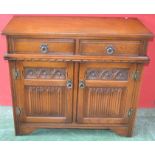 An Old Charm side cabinet, two short drawers over linenfold cupboard, 81cm high, 93cm wide, 43.