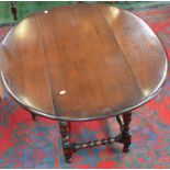 An Ercol elm drop leaf coffee table