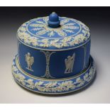 A Wedgwood blue jasper stilton dome, typically sprigged in white with classical figures,