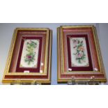 A pair of Capodimonte floral wall plaques,