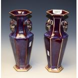 A pair of Chinese stoneware flambé hexagonal inverted baluster vases,