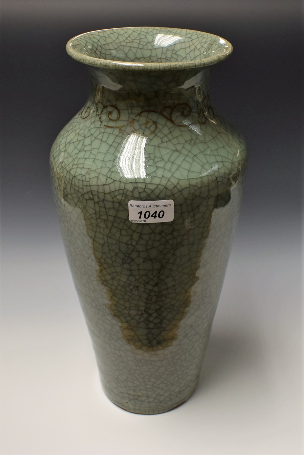 A large Chinese crackle glazed celadon ovoid vase, flared rim above a band of gilt scrolls,