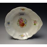 A Nantgarw shaped circular plate, the rim brightly painted with apple blossom,