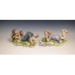 A pair of Capodimonte figures,