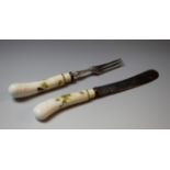 A 19th century German porcelain-hafted dessert knife and fork, possibly Meissen,