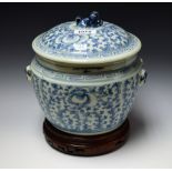 A 19th century Chinese ginger jar and cover, painted with peonies and scrolling foliage,