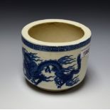 A Chinese circular jardiniere, printed in underglaze blue with a dragons chasing a flaming pearl,