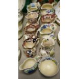 A collection of eight Masons Ironstone jugs; sugar bowl;