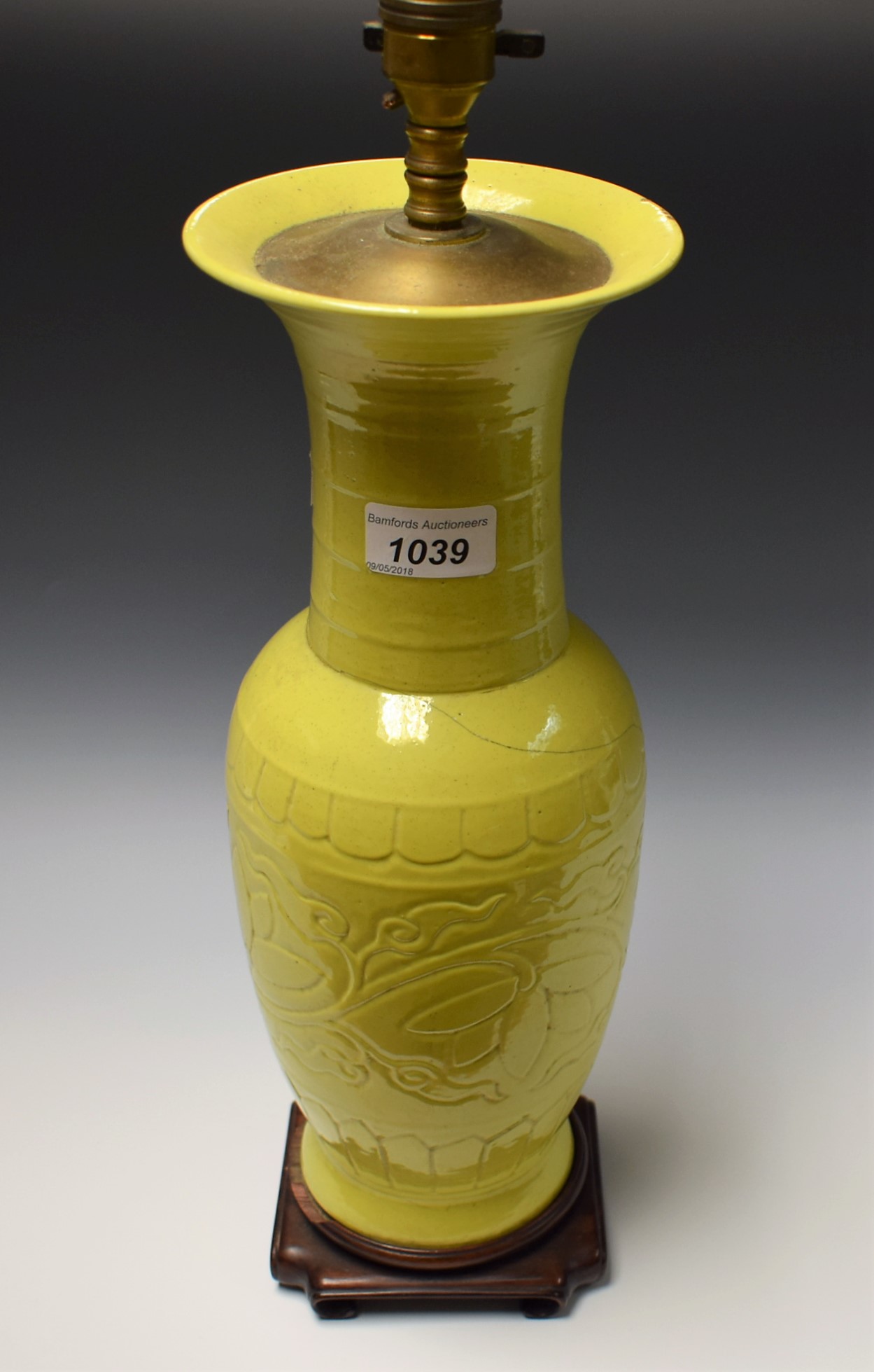 A Chinese monochrome yen yen vase, tall flared neck, incised with a a broad band of lotus,