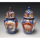 A pair of Imari vases and covers,