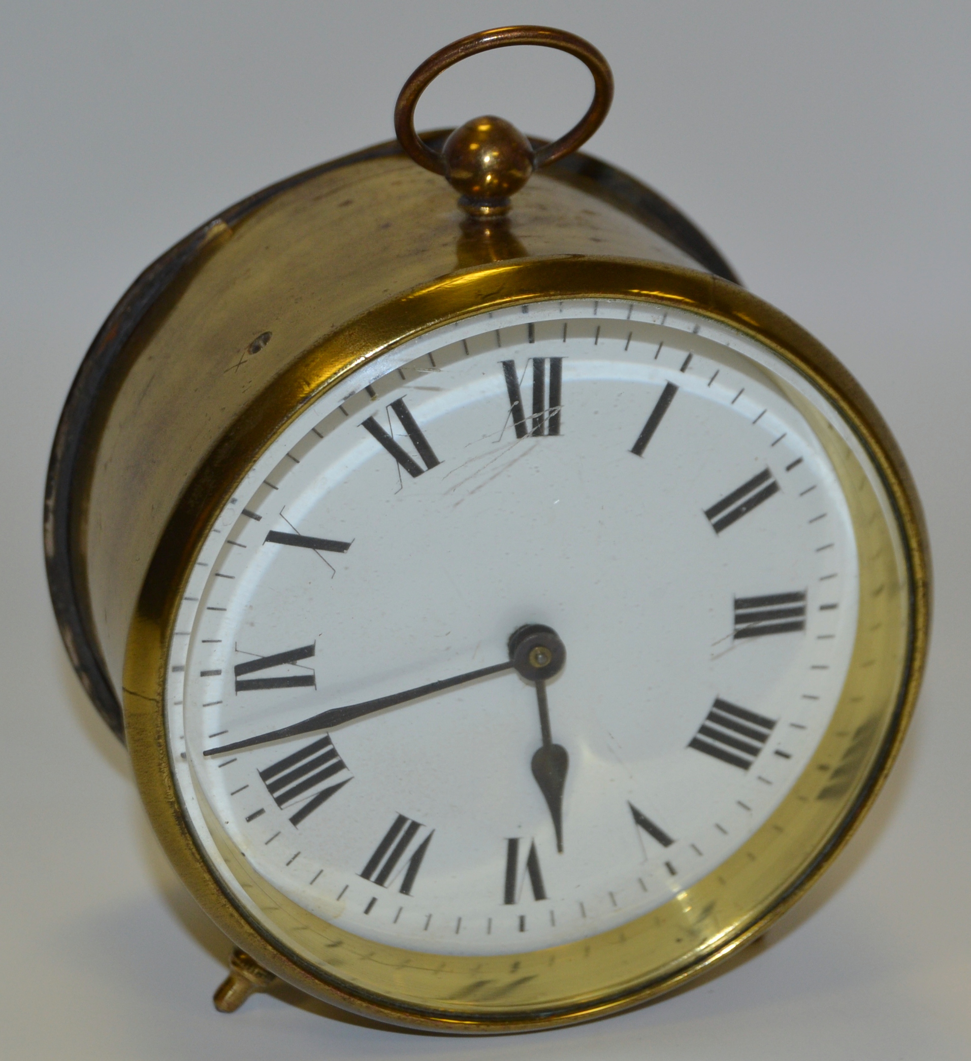 An early 20th century French lacquered brass drum timepiece, c.