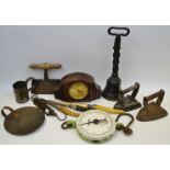 An early 19th century door porter; early 20th century oak mantel clock; 19th century dough cutter;