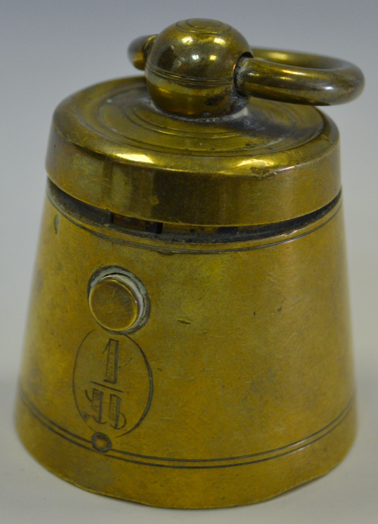 A late Victorian/Edwardian brass novelty inkwell, as a 1lb weight, c.