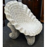 A novelty garden seat in the form of an open Giant Clam shell, scrolling clam supports ,