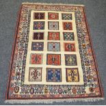 A Sozani rug, the madder field inset with 3 rows of Kilim carpet,