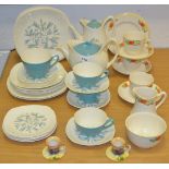 A Midwinter Stylecraft Fashion shape part tea service comprising of four cups, 3 saucers,