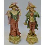 A pair of Royal Dux Bohemia figures of a Beau and his Gallant on stepped socle base,