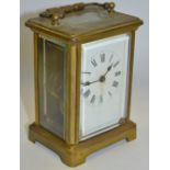 An early 20th century lacquered brass carriage timepiece