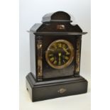 A 19th century belge noir mantel clock by Japyfreres,