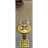 A late 19th century brass oil lamp, with fluted columns, stepped square base,