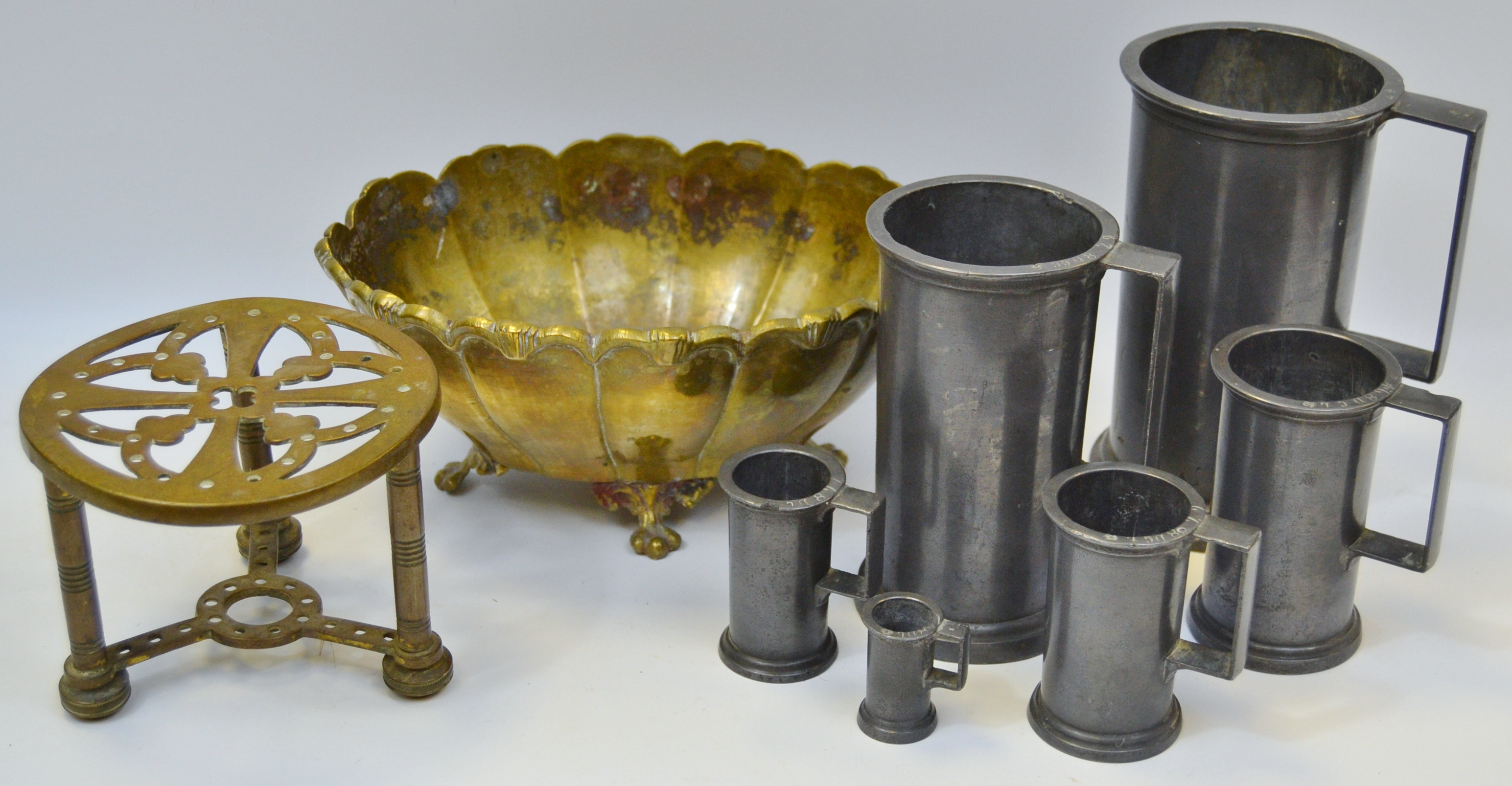 A set of six graduated 19th century pewter grain measures; a gilt bronze dish;