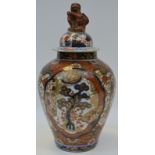 A Oriental temple jar and cover, decorated in the imari palate with stylised flowers and foliage,