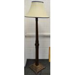 An early 20th century oak standard lamp,