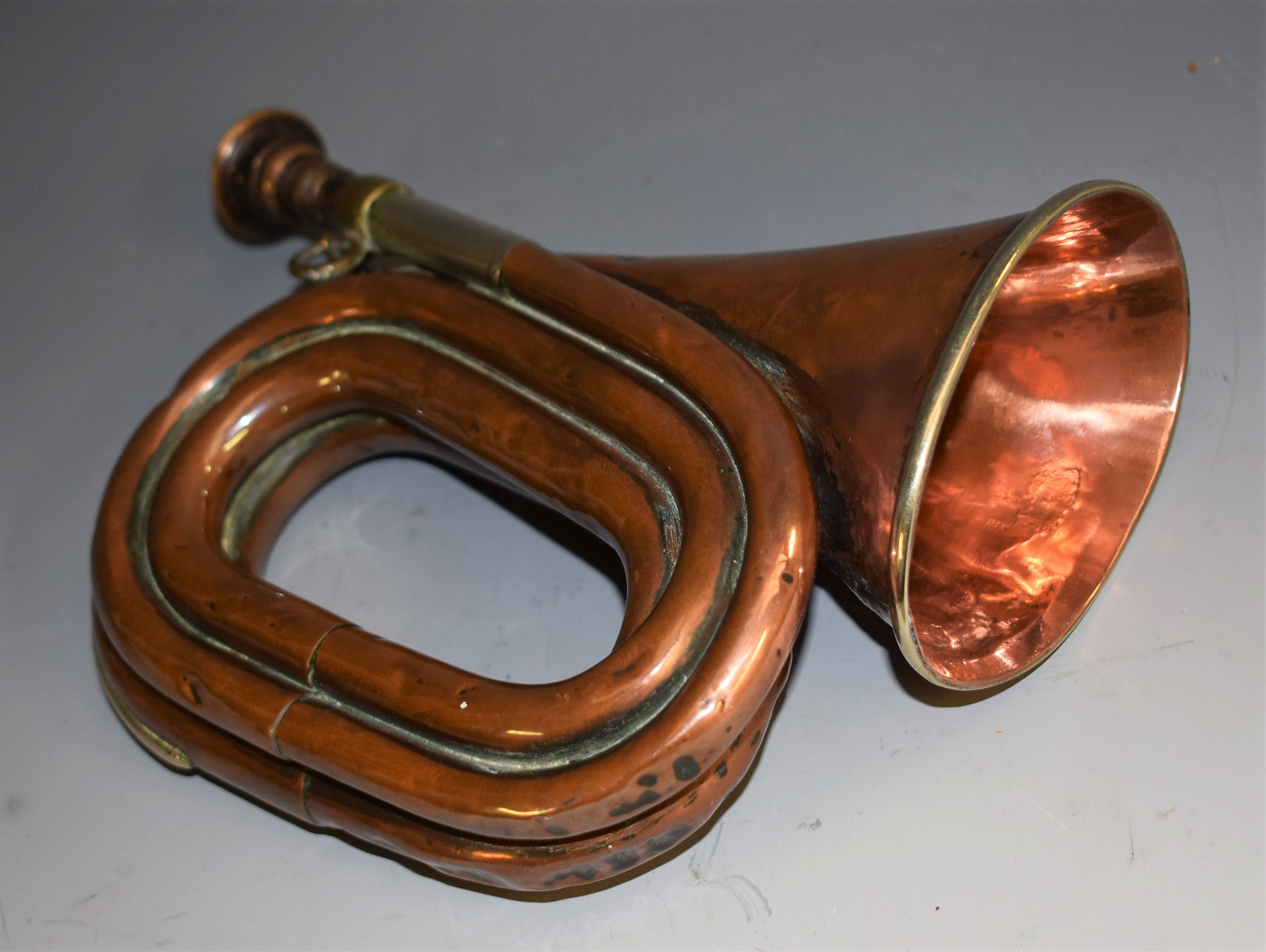 A Ward & Sons Liverpool copper four turn bugle, brass mouth piece, 18.