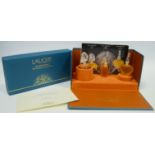 Lalique - a boxed set of three scent bottles from the Falcon Collection including Le Na ,