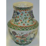 A Chinese Famille Verte vase, decorated with fanciful birds and foliage,