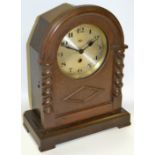 An oak cased mantel clock, silvered dial, Arabic numerals, c.