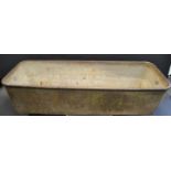 A substantial William Aickman Lynn cast iron trough, loose ring handles to sides, 183cm long,